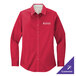 A medium red Port Authority long sleeve dress shirt on a counter with a company logo.