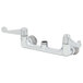 A silver Equip by T&S wall mount faucet base with 8" centers and 4" wrist action handles.