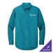 A Port Authority teal long sleeve dress shirt with the company logo.