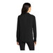 A woman wearing a Mercer+Mettle black long sleeve camp blouse.