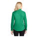 A woman wearing a Port Authority court green long sleeve dress shirt.