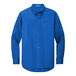 A Port Authority blue long sleeve dress shirt.