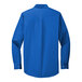 A Port Authority blue long sleeve dress shirt.