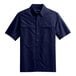 A navy blue short sleeve Port Authority shirt.