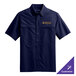A navy Port Authority short sleeve shirt with gold embroidery.