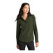 A woman wearing a Mercer+Mettle Townsend green long sleeve blouse.
