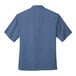 A Port Authority blue short sleeve camp shirt.