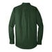 A Port Authority deep forest green long sleeve button down dress shirt.