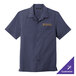 A Port Authority True Navy short sleeve staff shirt with a logo on it.