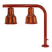 A Hanson Heat Lamps smoked copper finished aluminum and brass countertop heat lamp pole with two lights.