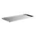 A stainless steel shelf tray that attaches to a white rectangular work table.