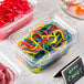 A plastic container of Gustaf's Rainbow Licorice Laces.
