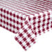 A close-up of a burgundy and white checkered Intedge vinyl table cover on a table.