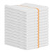 A stack of white Monarch Brands bar towels with gold stripes.