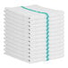 A stack of white towels with green stripes.