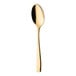 A Sola Netherlands stainless steel demitasse spoon with a gold handle.