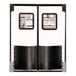 A white Chase Durulite double swinging traffic door with black trim and windows.