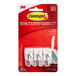 A red and white package of 3M Command white plastic wire hooks.