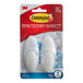 A package of white 3M Command bath hooks.