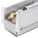 A metal box with a metal piece inside.