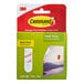 A green and white box of 3M Command poster strips.