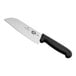 A Victorinox Santoku knife with a black handle.