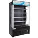A black refrigerated air curtain merchandiser with glass doors.