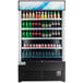 An Avantco black refrigerated air curtain merchandiser with a display of soda bottles and cans.