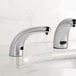 A Waterloo chrome soap dispenser with a foam spout on a white counter.