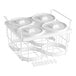 An Avantco white plastic container holder for four tubs with lids.
