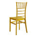 A gold Lancaster Table & Seating chiavari chair with a wooden back.