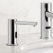 A Waterloo chrome automatic soap dispenser.