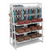 An Econoco white double-sided retail shelf with bags and purses on it.