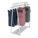An Econoco glossy white double-sided A-frame retail clothing rack with 2 hangrails and 2 faceouts filled with dresses.