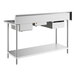 A Regency stainless steel work table with sinks on the right.