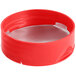 A red plastic spice container with a red induction-lined dual flapper lid with 3 holes.