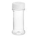 A clear plastic round spice container with a white dual flapper lid.