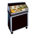 A black Alto-Shaam heated food display case on a short mobile base.