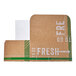 A cardboard take-out box with a white cover with the words "Fresh Print" in white.