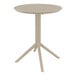 A Siesta Sky taupe round folding table with a metal base and legs.