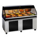 An Alto-Shaam black heated food display case on a counter with food trays inside.