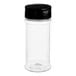 A clear plastic round spice container with a black dual flapper lid.