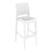 A Siesta Jamaica white wicker outdoor barstool with a seat back.