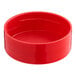 A 5.5 oz. round red plastic spice container with a red lid.