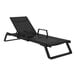 A Siesta Tropic black resin outdoor arm chaise lounge with black sling on a white background.