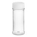 A clear plastic round spice container with a white lid.