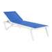 A Siesta Pacific white resin chaise lounge chair with blue sling.