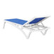 A Siesta Pacific white resin chaise lounge chair with blue sling.