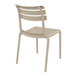 A taupe resin Siesta Helen outdoor dining chair with a backrest.