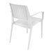 A Siesta Capri white plastic outdoor dining arm chair with a woven seat.